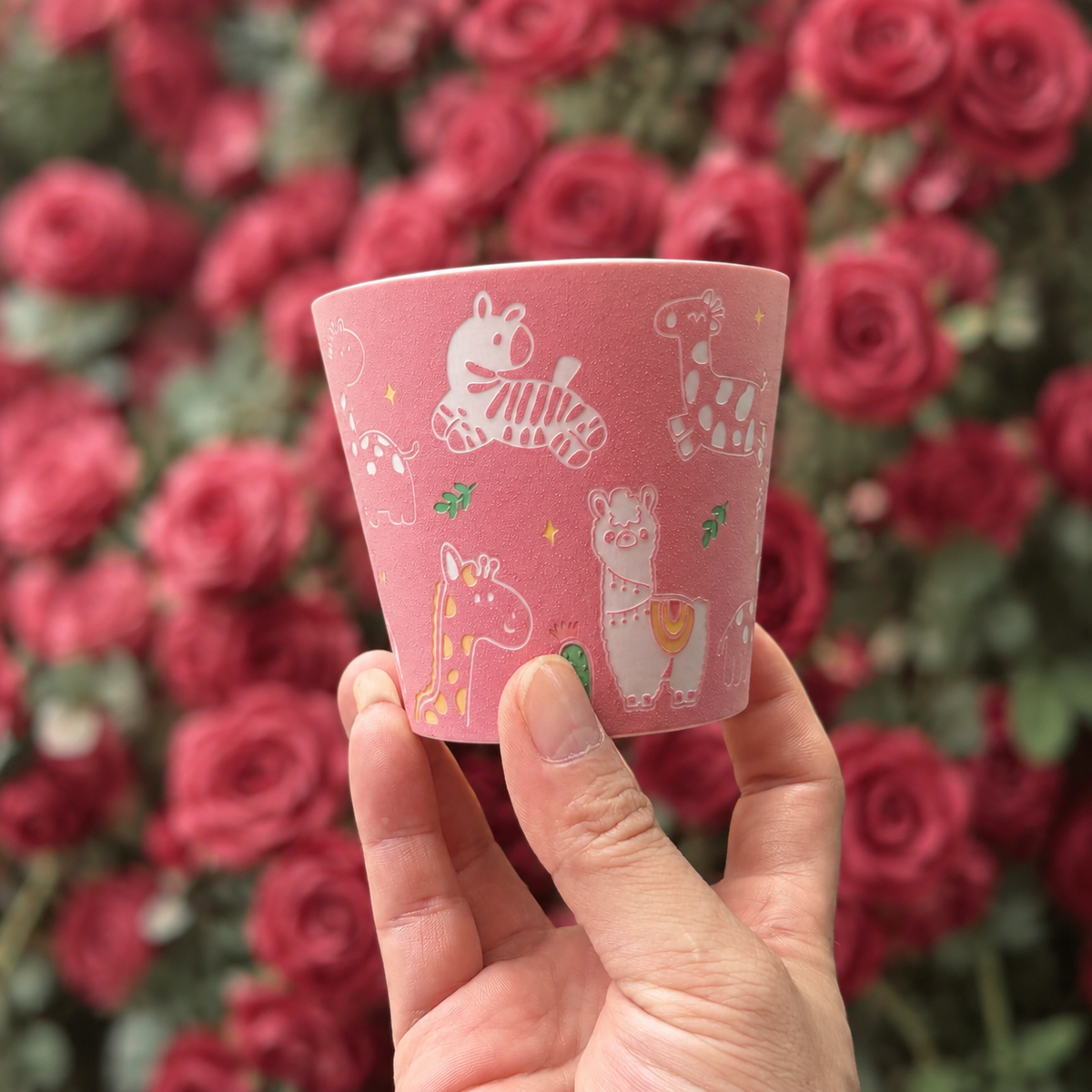 Pink Zoo Choko Cup — front view held in hand, retouched original photograph