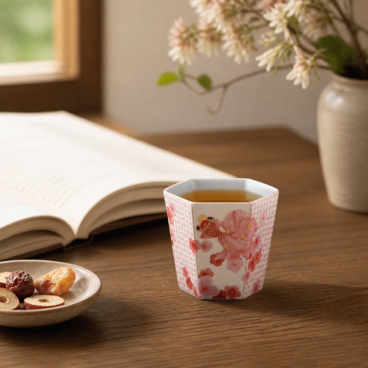 Fortune Bloom Hand Cup beside a book in a quiet reading scene