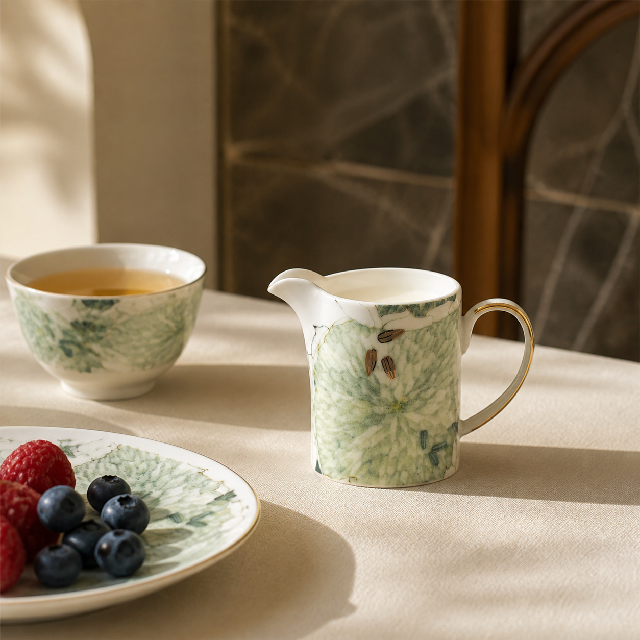 Chasing Light creamer beside tea and berries