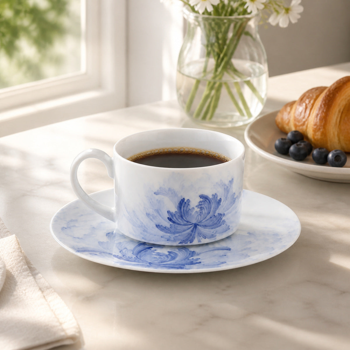 Blue Lotus cup and saucer in a bright breakfast coffee setting