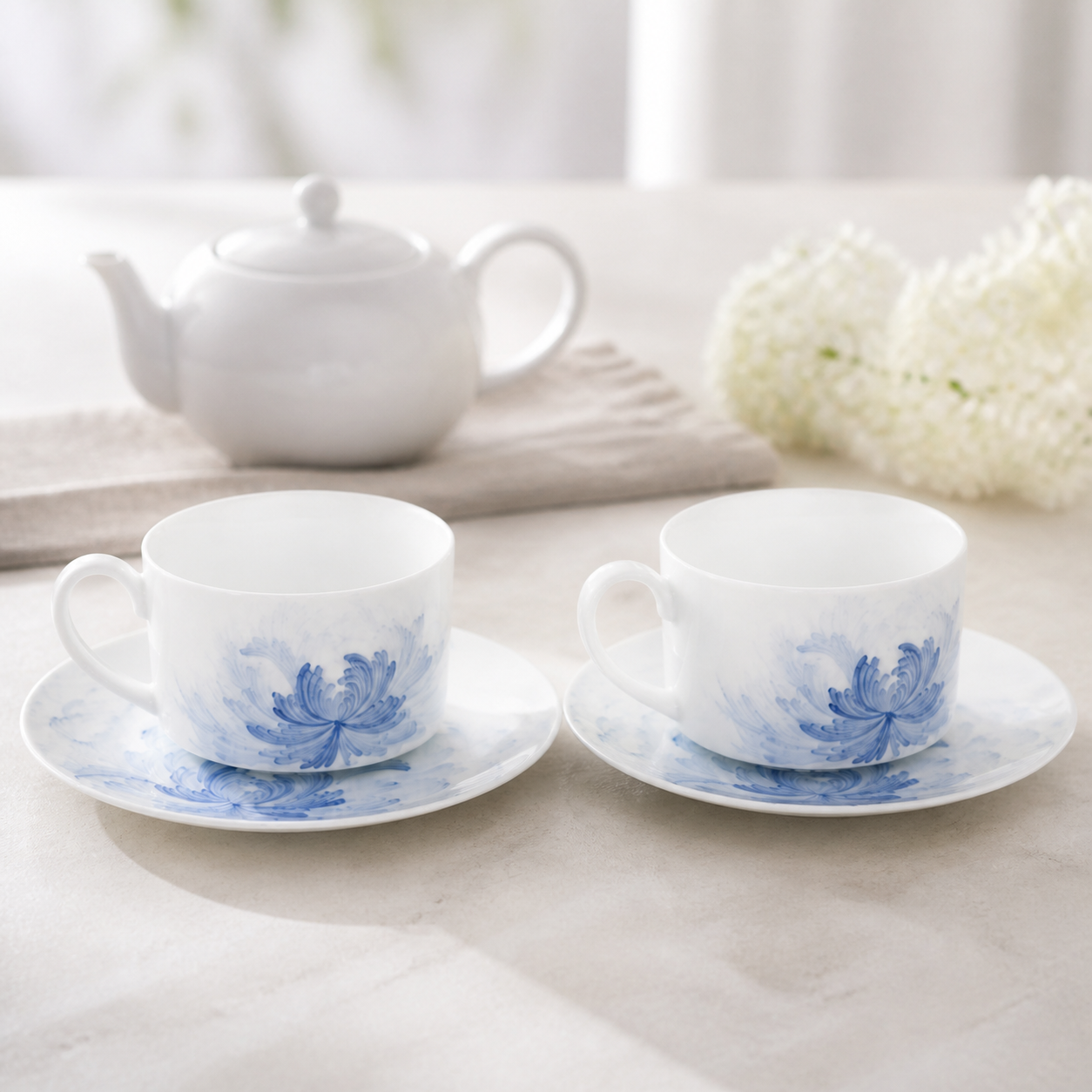 Blue Lotus pair cup and saucer tea scene