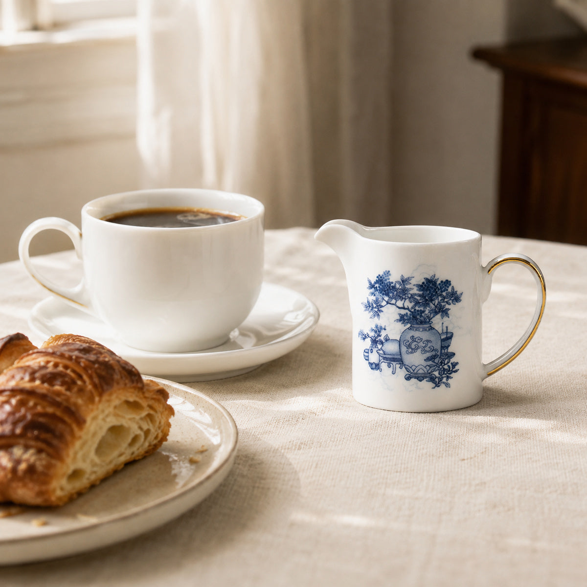 Golden Harmony creamer serving coffee at a bright breakfast table