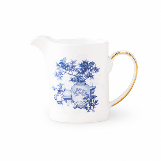 Golden Harmony porcelain creamer on a pure white background