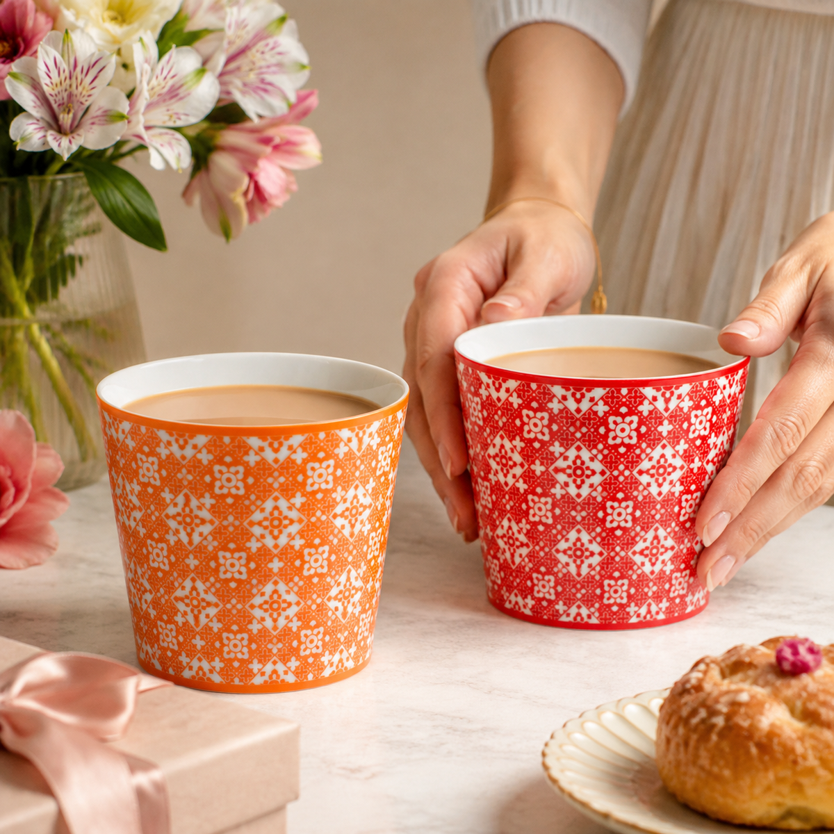 Red and orange Fanhua Choko Cups in a gifting scene