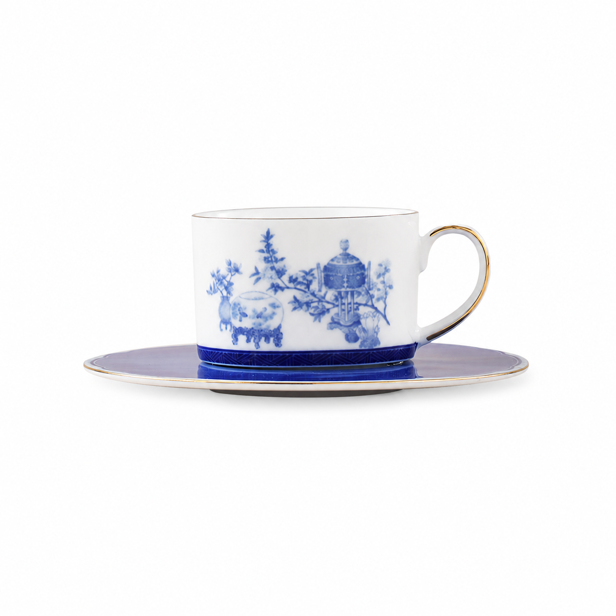 Golden Harmony cup and matching blue saucer on white