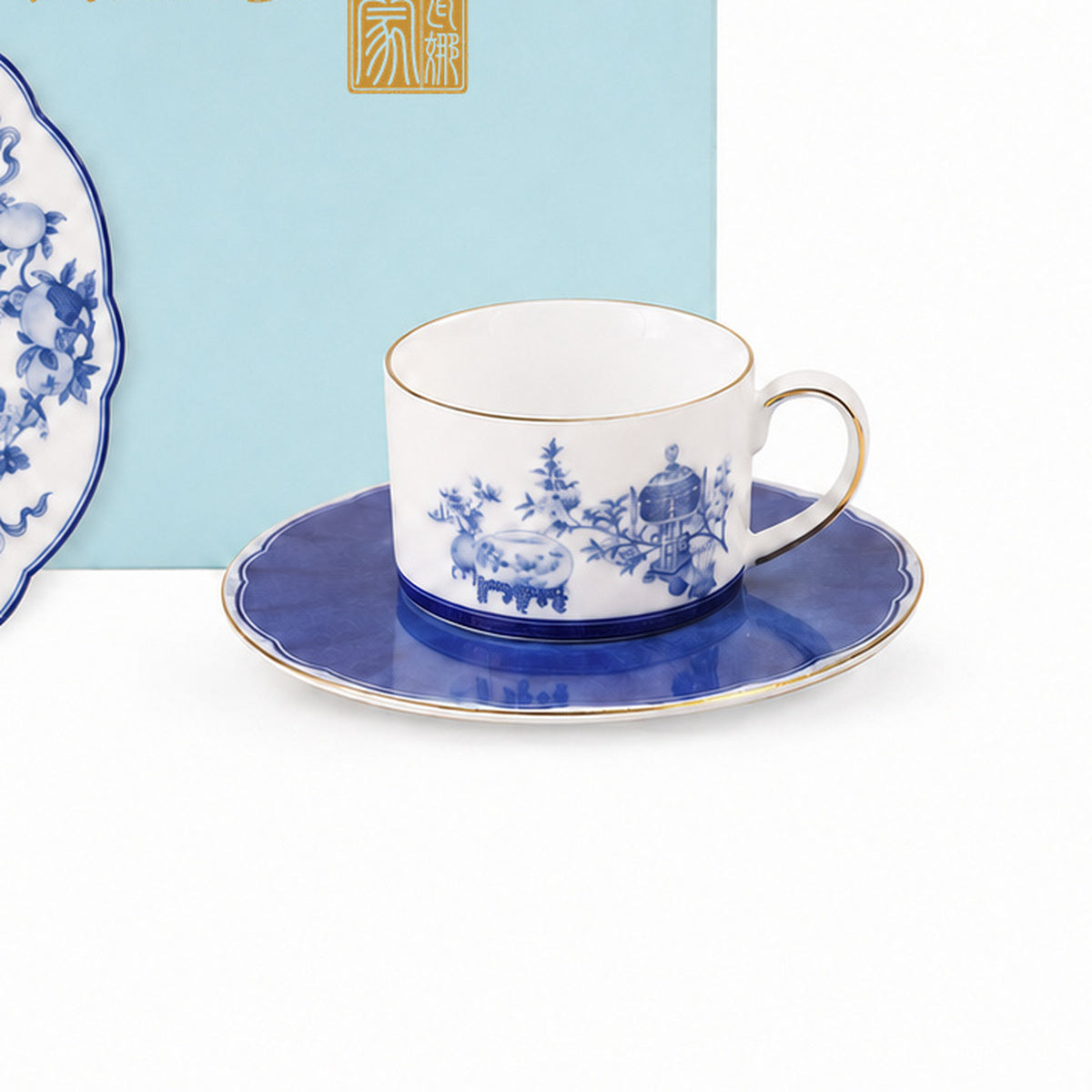 Golden Harmony porcelain cup and blue saucer decorative detail