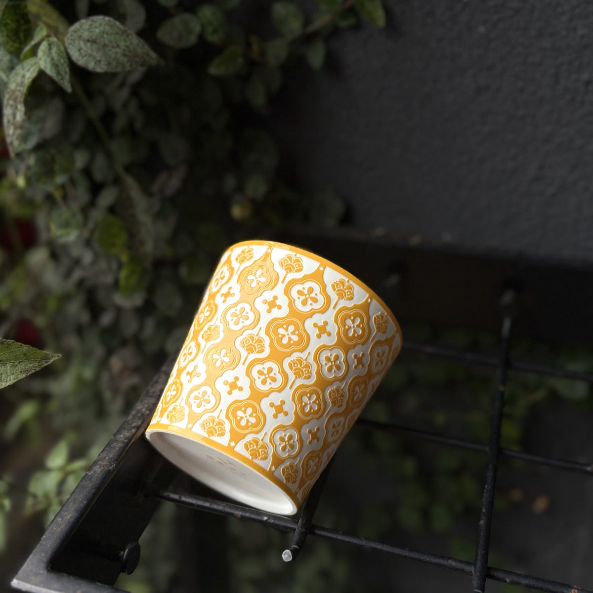 Yellow Baoxiang Choko Cup — angled real photo showing the floral pattern